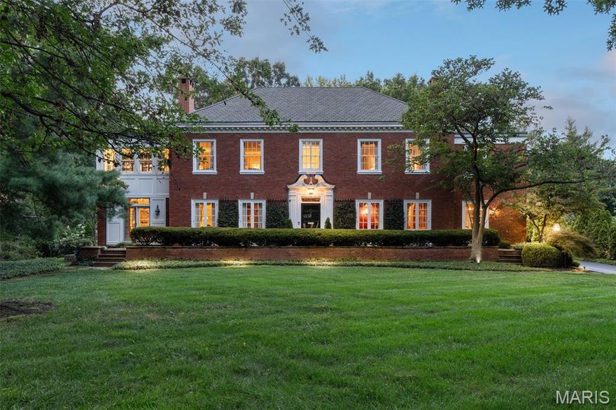 This 6,500 sq. ft. estate combines timeless architectural beauty with modern comfort, offering an unmatched lifestyle in one of Ladue’s most prestigious neighborhoods. Distinguished by its symmetrical facade, refined detailing, and manicured grounds, the home makes a lasting first impression.
Inside, the residence offers 5 bedrooms, 5 full and 2 half baths, designed with both elegance and livability in mind. Sunlit formal rooms with soaring ceilings and rich millwork provide the perfect setting for entertaining, while a welcoming family room and chef’s kitchen with custom cabinetry, premium appliances, and a central island create a natural gathering space for everyday living. Multiple French doors open to terraces and landscaped lawns, blending indoor and outdoor living with ease.
Upstairs, the expansive primary suite serves as a private retreat, featuring a spa-inspired bath and generous closets. Additional bedrooms and flexible living areas provide comfort and versatility, making the home ideal for both family living and hosting guests. Highlights of robust feature list include a partially finished lower level and oversized, attached 3-car garage.
Set on an estate-sized lot shaded by mature trees and framed by sweeping lawns, the property is equally suited for intimate evenings at home or large-scale entertaining.
Rarely does a residence of this stature become available in Ladue, an offering that blends classic design, exceptional space, and a prestigious address.