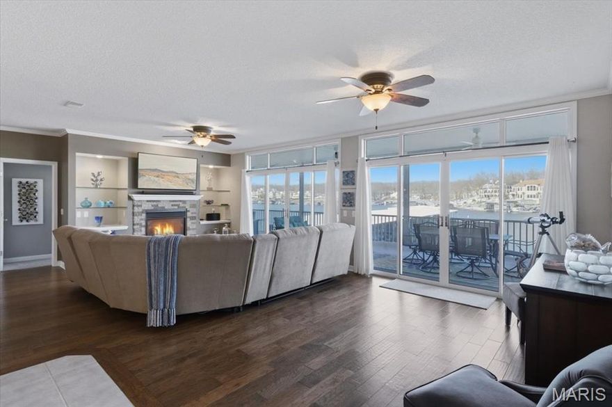 Rare opportunity to own a first-floor, turnkey 3-bedroom, 3-bath condo with an exceptionally large deck just steps from the dock. Located in Evergreen Cove at the 18 mile marker, perfect for tubing and wave runner fun, this approximately 1,800 sq ft condo is designed for both comfort and lake living.

The interior features flat-screen TVs, ceiling fans, and windows in every bedroom, along with a cozy fireplace and integrated Sonos sound system in the main living area. The kitchen offers stainless steel appliances, under-cabinet lighting, and opens seamlessly to the oversized northeast-facing deck, complete with a stainless steel grill, ideal for entertaining while enjoying afternoon shade.

The spacious master suite walks directly out to the large covered, screened-in patio and includes a generous en-suite bath with a Jacuzzi tub. A bunk room sleeping four adds flexible space for guests. Additional features include a Honeywell Wi-Fi thermostat for remote climate control.

Enjoy premium dock amenities with a 12x32 boat slip featuring a 10,000-lb lift, dock locker, and wave runner lift. Conveniently located just six minutes from grocery shopping and ten minutes from The Strip, this condo offers the perfect balance of relaxation, recreation, and accessibility.

Come, take a look!