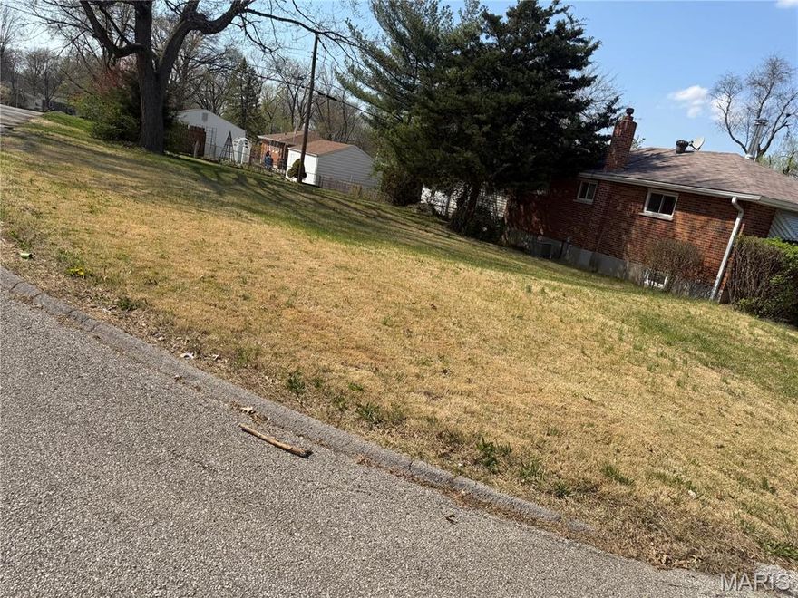 Beautiful vacant corner lot ready for your next home! Ideal for a single-family residence and conveniently located just minutes from the airport, making travel a breeze. Great opportunity to build now or in the future.