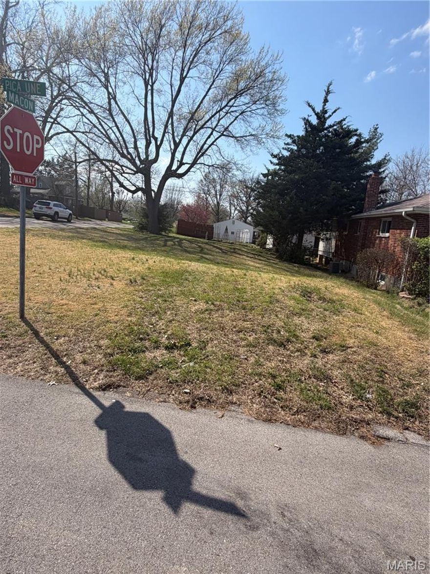 Beautiful vacant corner lot ready for your next home! Ideal for a single-family residence and conveniently located just minutes from the airport, making travel a breeze. Great opportunity to build now or in the future.