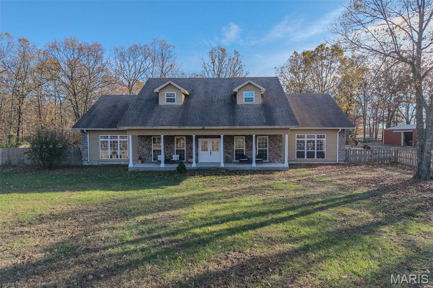 This stunning 4-bedroom, 3.5-bath home offers over 4,600 sqft of living space on 20 acres of land, providing privacy & tranquility just off State Hwy WW in Lebanon, MO.  The property features a gated entry, fenced acreage, cross fencing, & a pond—ideal for livestock. The spacious two-story home boasts an open layout, high ceilings, hardwood floors, and an abundance of natural light. The main level includes 2 large bedrooms, a master suite with dual vanities, a soaking tub, walk-in shower, and his-and-her closets. A convenient laundry chute in the home adds extra practicality. Upstairs, two oversized bedrooms share a full bath. Outside, you'll find a in ground storage shelter, 30x56 barn with electric, water & stove, a 24x40 shop with water and electric, & a 36x24 yellow shop building with electric & water, concrete floors, electric garage door, & cabinet storage. Additional 10x12 outbuildings provide even more space for storage. Privacy, acreage & a nice home this place has it all!