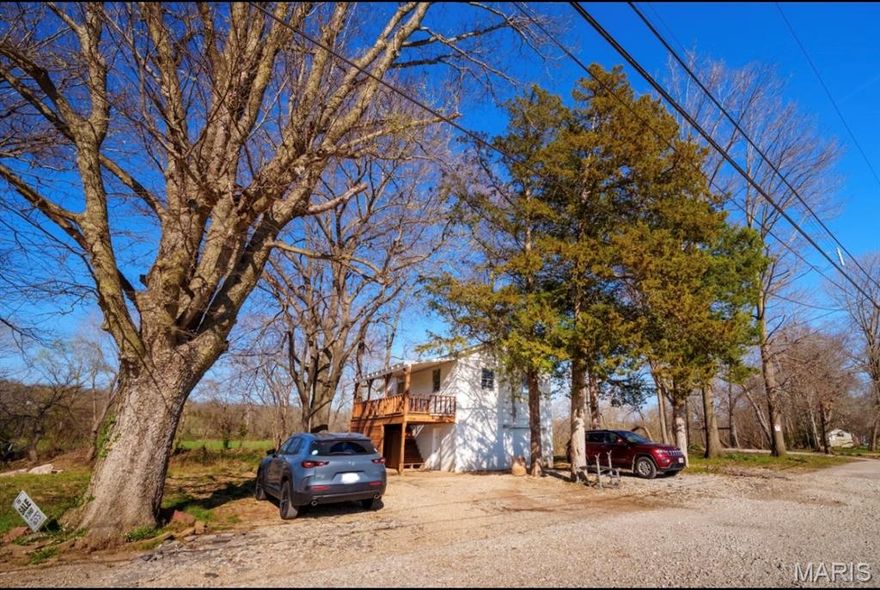 Looking for peace, privacy, and a place to fish right out your back door? This charming riverfront home offers exactly that. With steps leading down to Big River, this 2 bedroom, 1 bathroom home is the perfect retreat for anyone who loves the outdoors, quiet mornings, and relaxing water views. In the front, you’ll enjoy scenic farmland views that add to the calm, country feel. Inside, the home offers a little over 600 square feet of efficient living space, plus a basement garage for storage or parking. Even with its serene setting, you’re only 2 minutes from Highway 30, making this a rare combination of convenience and getaway vibes.