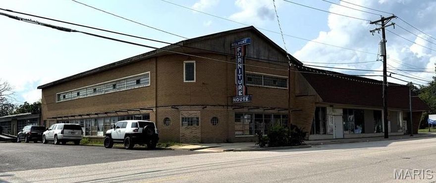 Great Investor opportunity!34,000 sqft of potential in this masonry, commercial/retail warehouse. The building is suitable for sub divide. 2 concrete floor warehouses, 2 vast showrooms, and multiple office spaces/rooms. It even has a loading dock! The left portion of the building offers a 4,000 +/- second story, great for office space and/or overflow. Off street and street parking available. Great historical, high traffic, corner location! Contents negotiable. Not suitable for production/manufacturing.