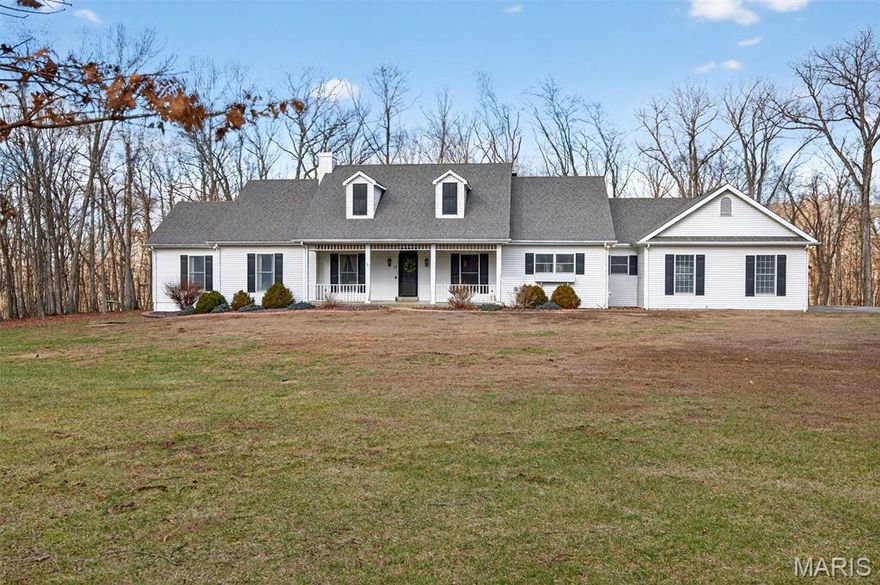 Spacious ranch home on 3 acres in one of the most beautiful settings in St. Charles County. Welcome home to picturesque rustic hardwood floors, a spacious country kitchen, large windows, vaulted ceilings, and TWO cozy fireplaces. The front, back, and side yards boast lovely mature trees placed perfectly to enhance the view and privacy. The pool (complete with a waterfall, salt water, and heater) and outdoor kitchen are the perfect entertaining space for at least three seasons! Relax and enjoy the calm evenings or an early morning coffee from the privacy of your screened-in porch. Spacious, oversized garage allows for storage space plus three vehicles. The wood-burning stove in the basement allows for cost-effective heat all winter long. Do not miss this gorgeous open concept kitchen, use the breakfast nook as your full-time meal space, or the flexible office/ dining room just off the front of the house when entertaining. The list of customization in this home goes on and on: spacious primary bed/ bath & closet, four main floor bedrooms, some walk-in closets, beautiful built-ins throughout, fresh paint, new carpeting in the basement, large windows, expansive front porch, basement wet bar, walkout, egress windows, public water, and newer HVAC. Located in the coveted Francis Howell School District. This beautiful home is one you are not going to want to miss!