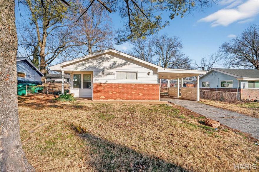 Charming one-story ranch home with great curb appeal in St. Louis! This inviting 3-bedroom, 1-bath property features a spacious living room filled with natural light and finished in neutral colors, creating a warm and comfortable atmosphere.

The kitchen offers excellent functionality with plenty of storage, a tile backsplash, and appliances including a refrigerator and range. The home’s layout provides comfortable living spaces ideal for everyday living and entertaining.

Outside, you'll find a fenced yard perfect for pets, play, or relaxing outdoors, along with the convenience of a 1-car carport. With its welcoming feel, practical features, and classic ranch-style design, this home is ready for its next owner to move in and make it their own.