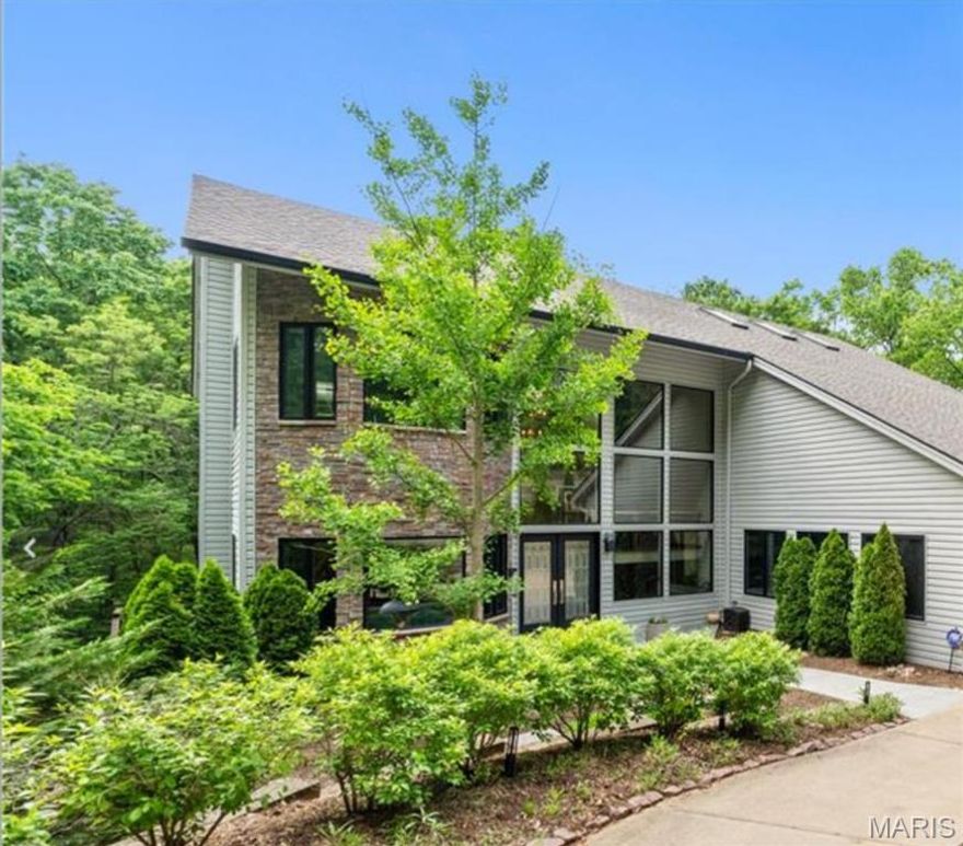 Searching for a home where you wake up feeling like you’re on vacation? Welcome to your private oasis in Kirkwood, tucked away surrounded by trees and the soothing sounds of Sugar Creek. The dramatic 2 story Great Room with Stone Fireplace gives you views of the beautiful woods on the backside of your home. The 3 car garage is a rare feature in the Kirkwood market. The kitchen perfect for quiet nights at home or for gatherings around the statement island, was completed by Mosby in 2020, with Miele, Dacor & Viking appliances.  A study with 1/2 bath, en suite bedroom & main floor laundry complete the first floor. Imagine taking a refreshing steam shower and enjoying coffee with the tranquility of the private Primary Suite’s deck or fireplace. The large Primary includes his and hers walk-in closets. A tucked away landing space and an en suite bathroom round out the upper level. The incredible lower level with full bar, a 3rd fireplace, 2 bedrooms, one en suite, another full bath, this is where you will make memories of incredible gatherings. This level walks out to the screened in porch with outdoor kitchen, updated in 2020 by Mosby with a gas grill, oven, pizza oven and sink bar. With the soundtrack of the soothing sounds of the creek and watching the changing of the leaves as fall approaches, you will make memories in your home that will last a lifetime.