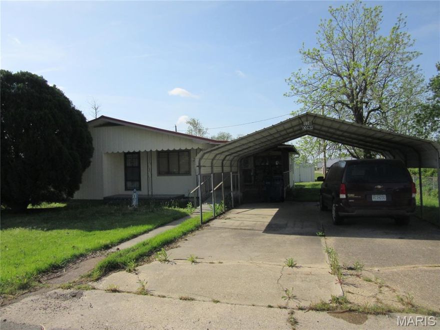 Nice 2 bedroom 1.5 bath home with metal carport, covered front deck and front porch and covered screened back deck 16 x 16 storage room inside the house,  large family room with tongue & groove wood walls and ceiling 16' x 12' vinyl sided storage building and 12' x 12' metal storage building and 8' x 8' metal building.
