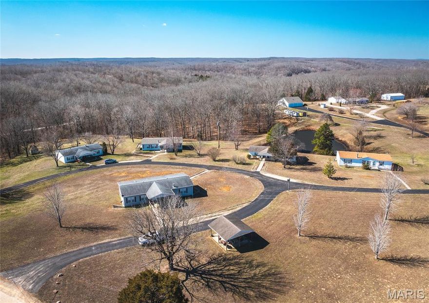 Incredible investment opportunity in Bollinger County, Missouri, offering both income potential and peaceful rural living. Conveniently located with great access just off Highway 51, this versatile property spans approximately 11+/- acres and features four manufactured homes, each offering 3 bedrooms and 2 bathrooms. The layout provides an ideal setup for generating steady rental income or creating a multi-family living arrangement. Tenants and owners alike will appreciate the shared pond on the property, perfect for relaxing and enjoying outdoor recreation. Whether you're looking to expand your rental portfolio or invest in a property with long-term potential, this unique offering checks all the boxes.