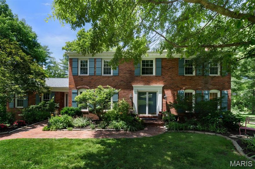 Set on a stunning one-acre lot at the end of a quiet cul-de-sac in the heart of Town & Country, this home offers something increasingly rare: a private, tree-lined retreat with a walkable lifestyle built right in. Stroll to the Town Square for boutique shopping, dining, and live music, or take in the community events that bring neighbors together throughout the year. Miles of walking and biking trails wind through stunning parks in every direction, all within a couple of miles from your front door. This is the Town & Country lifestyle at its best.

Inside, the gracious foyer opens to formal living and dining rooms with classic architectural details and newly refinished wood floors throughout. The family room draws you in with a beamed ceiling and cozy fireplace, flowing naturally into the brand-new kitchen and breakfast nook. Thoughtfully designed for real life, the kitchen offers a beautiful layout and a view of the backyard that keeps you connected to the outdoors while you cook.

A first-floor office or optional bedroom, a dedicated full bath, laundry room, and a powder room round out the main level. Upstairs, the spacious primary suite offers a private bath and walk-in closet, with three additional bedrooms and a full bath giving everyone their own comfortable space. The finished lower level provides flexible room for movie nights, play, or a teen retreat, and the walk-out basement includes a sixth bedroom and full bath, ideal for guests or multi-generational living.

Step outside and the property itself becomes a destination. A meandering creek adds a peaceful, natural backdrop to the spacious, flat yard, while established landscaping delivers beauty and character throughout every season. Whether you are hosting a summer gathering, letting kids roam, or simply enjoying a quiet morning with coffee, this backyard delivers. Located in a highly-rated school district, and minutes from countless prestigious private schools, this home offers the space, the setting, and the community that define the very best of Town & Country living.