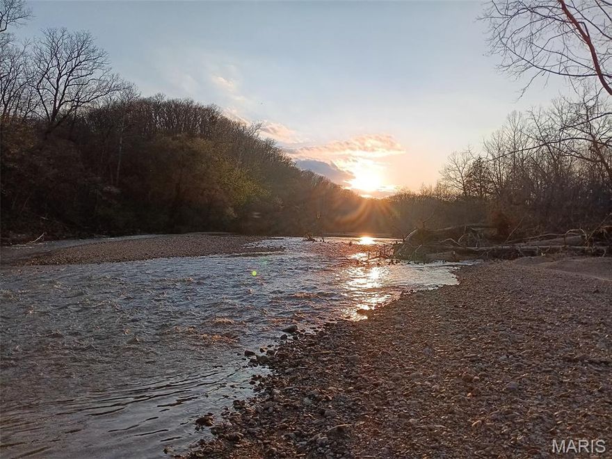 140 m/l Acres on the Upper Jack's Fork River - Willow Springs, MO This exceptional 140-acre property with no restrictions which offers a rare mix of wooded and open ground with frontage on both sides of the Upper Jack's Fork River this property provides exceptional access for swimming, fishing, wildlife viewing, and year-round enjoyment. The Upper Jack's Fork is especially prized for its peaceful setting, lighter float traffic, and unspoiled natural beauty, making it ideal for those seeking privacy and a true Ozarks River experience. The home features 3 bedrooms (one non-conforming) and 2 bathrooms, along with an oversized 2-car attached garage. A cozy fireplace, covered front porch, central ac/propane heat and root cellar add comfort and functionality. Water is supplied by a fresh spring-fed well pumped directly to the house for wonderful spring water. Additional improvements include a large barn/garage, perfect for equipment, livestock, or recreational storage. Located in the Summersville School District, this property offers privacy, recreation, and self-sufficiency in a scenic river setting. Whether you are looking for a full-time residence, hunting retreat, or recreational getaway, this property delivers outstanding outdoor opportunities and rural charm.
