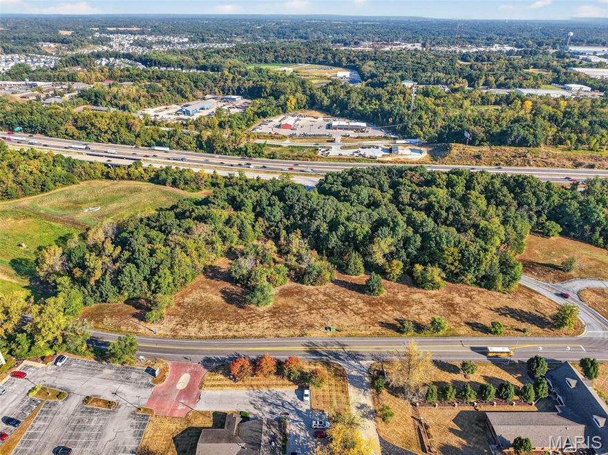 5.82 Highly visible commercial acres between Lake Saint Louis Blvd and the South Service Road of I-70 (Veterans Memorial Parkway) in an ideal location! An additional 8.19 acres of commercial ground is available immediately adjacent to and across the street, for a total of 14.01 acres!  Commercial ground along the I-70 corridor, in LSL and close to an overpass is becoming increasingly rare... don't miss out on this opportunity to showcase your business plan in a highly visible and sought-after area! All City utilities are available! Planned unit developments with a strong commercial component are encouraged! Schedule your appointment today! Additional 8.19 acres available see Listing #25063755.