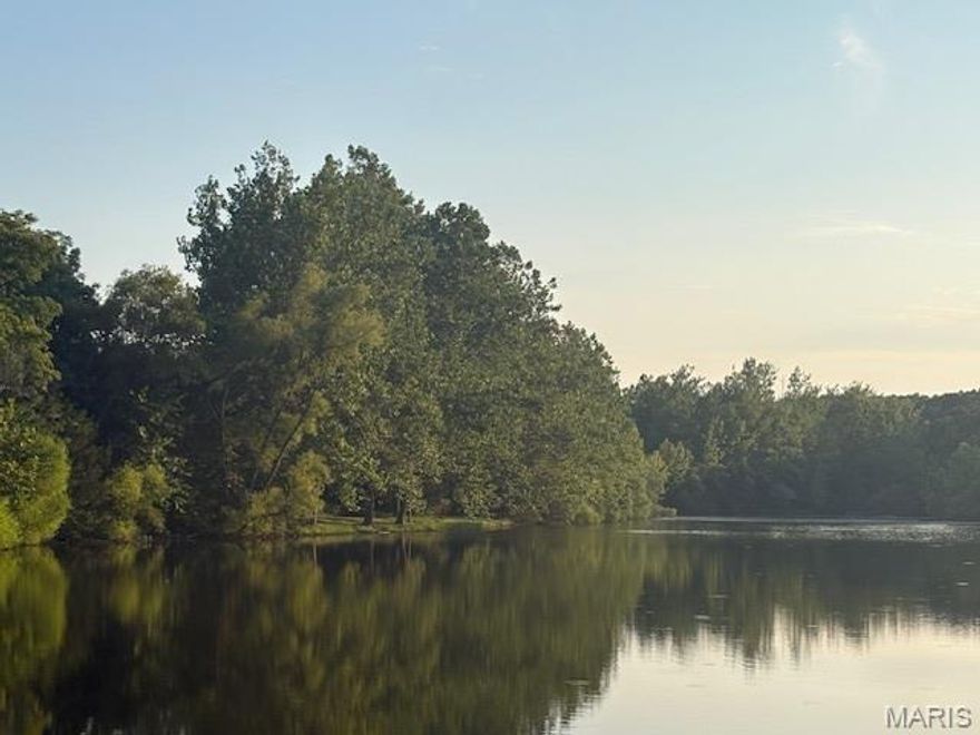 Lake Front Lot on Small Private Lake / Summer Lake! This a private oasis on this 12 acre lake. Imagine walking out your back door and casting out your line ... 

Live like you're on vacation every day with resort-style amenities, also including:

4 private community lakes for fishing, boating, kayaking

Beaches, swimming, and scenic lake views

Golf course, country club, and on-site restaurant

Hiking, biking trails, campgrounds, and sand volleyball

A golf cart-friendly community for relaxed neighborhood living

You can bring your own builder and plans, or hold the land as an affordable way to enjoy Raintree's full range of recreation and lifestyle benefits.

Ownership includes access to the Country Club for just $271/year, and full community amenities for only $250/year. All of this just 35 minutes from South County (63128)!

Build your own lifestyle and just getaway from it all.  See all photos for a glimpse into the incredible Raintree lifestyle. As a resident myself, I can confidently say: it’s an amazing place to live, play, and relax. Come join us!