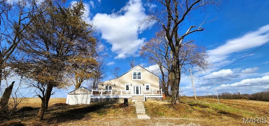 Here is a "hidden treasure" that is truly an end-of-the-lane home nestled on a tree-lined one acre lot amidst an agricultural farmland. Originally built in 1945, now newly remodeled over the past year w/updates & upgrades galore! This home is a 3 bedroom, Big 1 bath home displayed as a 1 1/2 story w/main floor primary bedroom plus a 2nd main level bedroom, and the 3rd is upstairs which also can be a family room. The etched glass doorway allows entry to the front side of the home w/vaulted ceiling front Bedroom to the far left through the Living Room & to the right that leads to the Dining Room. Moving forward past the waterfall granite topped Breakfast Bar is the open Kitchen full of modern stainless steel appliances w/high-tech featured refrigerator/freezer, electric smooth-top range, microwave, three-tiered dishwasher, disposal, granite countertops & glass tile backsplash. Head to the rear of the Kitchen where the Laundry has its own large room w/wall of windows having an egress w/dog door to the fenced rear yard. 2 Nice sized main floor bedrooms w/vaults, canned lights & ceiling fans. The Bathroom is exquisitely finished which features a vaulted ceiling, multiple-sided windows, recessed lighting & ceiling fan. Take the stairway up to the third Bedroom or could be used as a family room w/loft style setting w/vaulted ceiling, recessed lighting, multiple-sided windows & an exposed brick column. Full clean, dry basement for storage. There is an abundance of natural light throughout by its plentiful new vinyl windows accompanied by recessed lighting. It serves a comfortable environment w/a series of mini-split units w/dedicated remote controls.  Exceptional large front porch deck to relax & socialize. 2-car detached Garage w/ barn door closures as a possible workshop allows for that as a second option from the under-deck side-access space that could be used for storage as well. Quiet & very private setting yet close to full city amenities, parks, shopping & schools. Come see today!