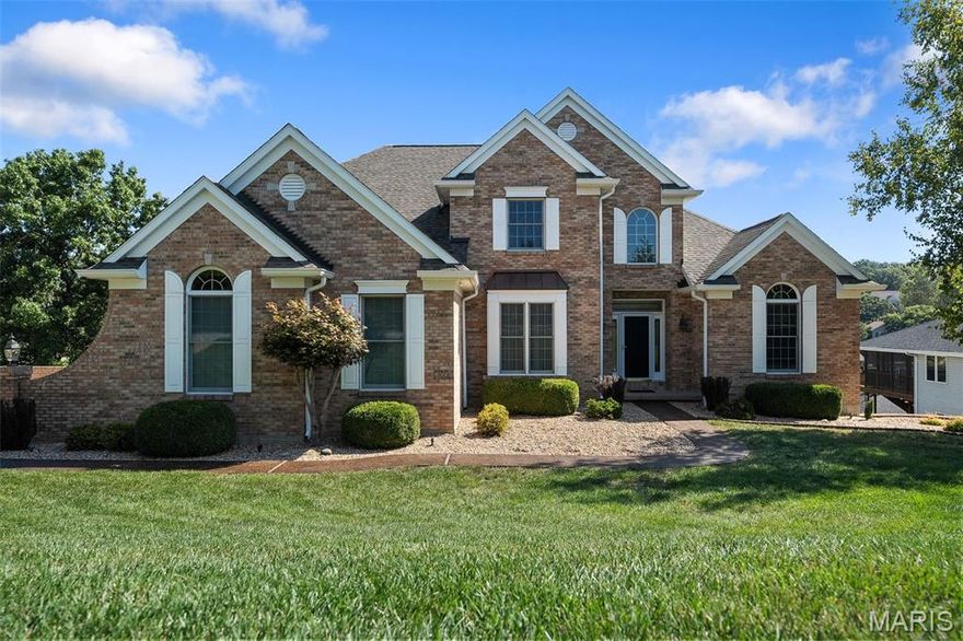 Welcome to 9583 E Vista Drive, where lake life meets everyday luxury in the gated community of Raintree Plantation. Perfectly positioned on 160 feet of waterfront in a peaceful no-wake cove, this stunning 1.5-story home offers a rare blend of privacy, recreation, and breathtaking views.

Imagine starting your mornings with coffee overlooking the water and ending your evenings with sunset reflections dancing across the lake. Step outside to your own private shoreline, complete with a small beach area, boat pavilion with electric lift, and a spacious patio designed for effortless entertaining or quiet relaxation by the water.

Inside, the home welcomes you with a dramatic two-story entry foyer and soaring great room filled with natural light and scenic lake views. The main level is thoughtfully designed for both everyday living and hosting, featuring a private office, formal dining room, inviting eat-in kitchen, and convenient main-floor laundry.

The primary suite is a true retreat, spacious and serene, with windows framing the lake just beyond your backyard. The ensuite bath offers dual vanities, a soaking tub, separate shower, and a large walk-in closet, creating a spa-like experience at home.

Upstairs, you’ll find three additional bedrooms, including a private suite and a Jack-and-Jill layout, providing comfort and flexibility for family or guests.

The walkout lower level expands your living space even further, offering a second living area, wet bar, additional bedroom, full bathroom, and a workshop with a garage door, perfect for storing lake toys, tools, or creating your ideal hobby space.

Beyond the home, the lifestyle continues. Raintree Plantation offers a truly unique living experience with private lakes, beaches, picnic areas, campgrounds, maintained roads, and gated security. a Membership to Raintree Country Club provides access to golf, a pool, and fitness facilities, bringing resort-style amenities right to your doorstep.