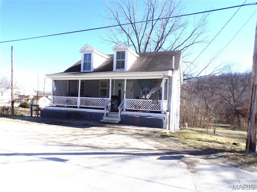 If you are willing to apply some TLC and some creative imagination, then this home could be a great starter home or a great investment property.  This spacious home offers 4 nice size bedrooms, 2 on the main floor and 2 on the lower level. The home has a nice size living room and a main floor bath. The lower level is a walk out with a large kitchen and breakfast area. There is a roughed in bath in the lower level that allows for a 2nd full bath. laundry area is near the kitchen and has a lot of extra storage space. This home sits on 4 lots with a total of 0.661 acres. There are plenty of trees and wood in the back so there is plenty of privacy. The yard is partially fenced so the kids and dogs have plenty of space to run and play. The home is situated in downtown Louisiana where it's close to schools, shopping and near the riverfront. Please note the back 2 lots are located in the flood plain. Please review the seller's disclosure for full details.