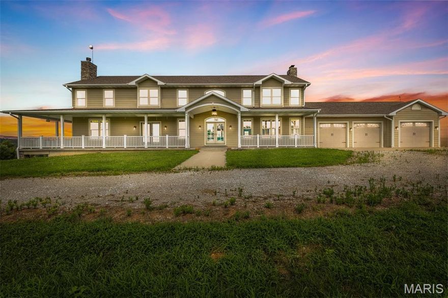 Exquisite Family Estate on 118 Ac +/- with Private 15 acre stocked Lake, Guest Home, Multiple Outbuildings & endless possibilities! This stately 4 bedroom 5 full bath 1.5-story home showcases superior craftsmanship along with high-end finishes throughout making it truly one of a kind. A long sweeping driveway & breathtaking views of the property & homes wraparound porch greet you on arrival. Inside, the open floorplan, gleaming hardwood floors, Designer kitchen & sunlit 2-story great rm are all competing for your attention. The kitchen has always been the heart of a home & this is no exception. Enjoy family gatherings in your designer kitchen w/ granite counters, spacious island, SS appliances, & expansive walk-in pantry plus Butler’s pantry. This Fall gather in your great room & cozy up around the wood burning fireplace that showcases floor to ceiling stone & a wall of windows with remote-operated blinds on upper windows. The main-level owner’s suite offers a wood burning fireplace, spa-like en-suite w/ custom Onyx shower, dual vanities, & dual walk-ins. Upstairs includes 3 spacious bedrooms, 2 baths, loft area, & laundry. Walkout basement features a summer kitchen, full bath, commercial freezer & cooler, laundry, &  two storm shelter/vault rooms. Geothermal HVAC, 3-car garage, 2 detached garages/shops, & 42x30 pole barn. Guest home is a 3BR/2BA modular on fdn. Endless potential, family estate, corporate retreat, equestrian haven, or hunting lodge! Too many extras to list!