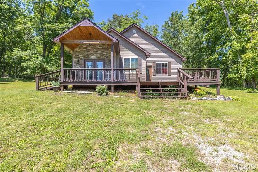 Custom built in 2017, this 2 bedroom, 1 bath home has a finished loft bonus room and is built above the historic 2017 flood line. It has lovely, wood car siding, a covered deck with stone front added to it recently, a 12x10 barn style storage building, and a 24/7 view of the water. It has deeded access to the common area lot with picnic area, grill, dock, and community boat launch. It comes furnished and ready to enjoy Life On The River.