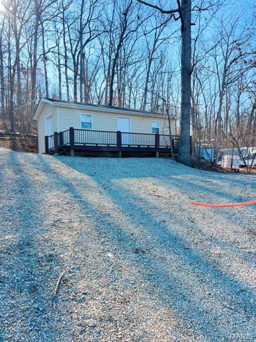 Charming one-bedroom dry cabin with beautiful lake views located in a secure gated community. This cozy retreat offers the perfect blend of relaxation and recreation, making it ideal for weekend getaways or peaceful full-time living.

The community features a stunning 400-acre lake, perfect for boating, water skiing, swimming, fishing, or simply enjoying a scenic cruise. Residents have access to two playgrounds, picnic areas, a community pool, snack bar, and two convenient boat ramps.

With a welcoming mix of residential and recreational properties, there’s truly something for everyone. Enjoy a vibrant calendar of community events including poker runs, holiday celebrations for adults and children, hayrides, mouse races, and more.

Don’t miss this opportunity to own your own lakeview escape in a fun-filled, amenity-rich community!