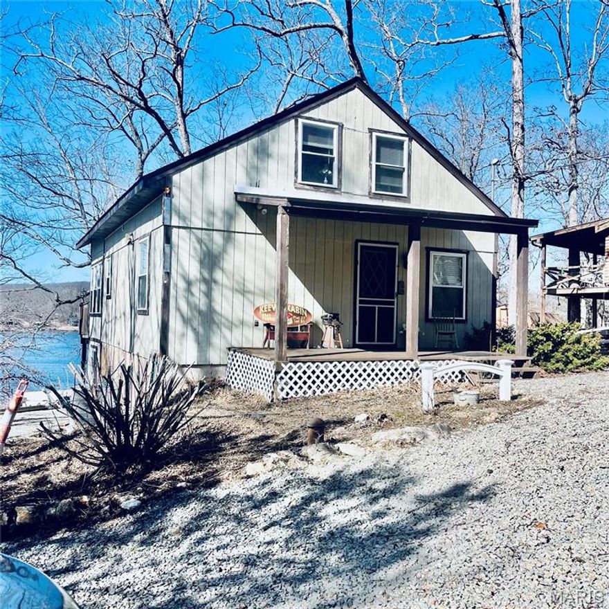 Lakefront Living at Its Best!

Lakefront home with private dock that includes a 2008 tri-toon boat and trailer and all of the contents — everything you need to start enjoying the lake right away!

This 3-bedroom, 2-bath home offers a versatile layout perfect for full-time living or a weekend retreat. The main level features one bedroom and a full bath, along with an open floor plan and stunning water views. The upper level includes a spacious open loft, while the lower level offers two additional bedrooms, a full bath, and a workshop with patio access — ideal for hobbies or extra storage.

Designed for entertaining, the outdoor space is a true highlight with expansive areas to gather and a beautiful tiki bar overlooking the water. Recent updates include a new roof, retaining wall, and patio repairs completed this year, giving added peace of mind.

Located in a gated subdivision with 24-hour security, residents enjoy access to a 400+ acre lake, community pool, two playgrounds, parks, two boat ramps, and a full calendar of community events. Whether you prefer boating and socializing or simply floating and relaxing, this community offers something for everyone.