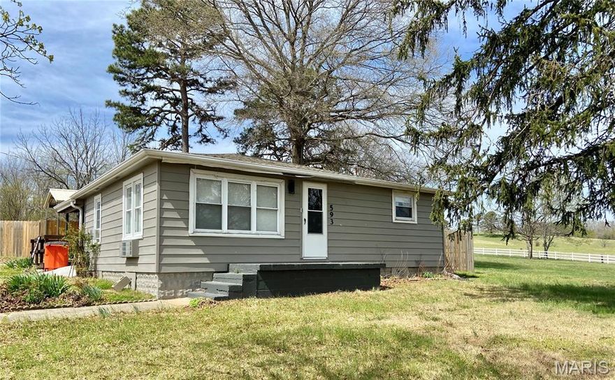 Cute 2 bedroom Bungalow on the edge of town . This home has been remodeled with new flooring , Backyard private fencing , a new extra tall carport . 18x24 detached metal Garage/Shop building . Large master bedroom . This home has window air and electric heat. Kitchen appliances stay with new homeowner. Large yard with wooden deck for outdoor entertaining. Aluminum siding home !