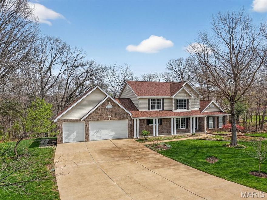 Prepare to be WOWED! 1.5 Story Home with a Main Floor Primary Suite and Finished Lower Level on a fantastic, wooded, 3 Acre Lot! The exterior is impressive with brick, vinyl siding, an oversized 3 car garage (29.7W x29.3D) that is fully drywalled with 8-foot tall, insulated garage doors, custom built workshop cabinetry and a service door to backyard and deck.  Added exterior features include garage coach lights, architectural shingles, leaded glass front door, a large front porch and lawn irrigation. There are two large decks off the back of the house offering spectacular views, one off the main floor and a composite deck off the walkout, finished lower level. Features include a dramatic two story Entry-Great Room-Dining area, Great Room with dynamic window wall and see through gas fireplace, wood flooring, formal Dining Room, main floor Office with double door entry, main floor Powder Room, Kitchen with solid surface countertops, downdraft electric cooktop, double wall ovens, island, custom cabinetry with soft close feature, corner walk in pantry, Breakfast Room with breakfast bar, main floor Laundry and more. The main floor Primary Bedroom Suite has a walk-in closet with custom organizers and a see-through gas fireplace. The on-trend Primary Bath has a jetted tub, custom tile shower, double bowl vanity and vaulted ceilings. Upstairs there are two large bedrooms with a shared bath with double bowl vanity. The walk out lower level is finished with a large Recreation/Family Room. a gas fireplace, a window wall, built in display shelves, huge bedroom with walk in closet, updated full bath, and a party Kitchen/wet bar with dishwasher and mini fridge.  There are 2 – 55-gallon water heaters.  The roof and soffits are newer (2024) and septic repairs/updates were completed in March of 2026.  Incredible setting, fantastic home, so much to love!