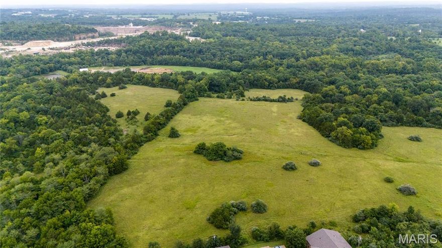 12.57 acres of land inside the city limits, yet on the tranquil edge of town. Ideal for residential or commercial projects, don't miss this unique opportunity to shape the future in a growing community.  Secure your slice of city edge-edge paradise today! Ideal homesite or make it your investment dream and develop it.