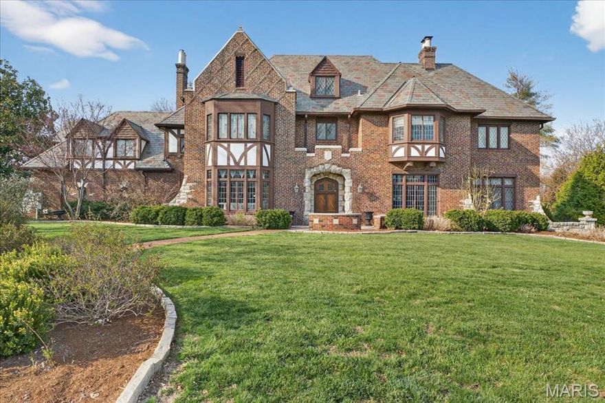 Nestled in the center of Lake Forest subdivision and commanding one of its most expansive sites, this distinguished brick and limestone Tudor estate is a rare blend of privacy, architecture, and curated outdoor living—framed by mature trees, a saltwater pool, a firepit lounge, and an elegant pergola retreat.

Inside, dramatic, light-filled spaces are rich with architectural character, featuring the finest building materials, soaring ceilings, meticulous leaded and stained glass windows, limestone fireplaces, and imposing chandeliers. The designer kitchen is both refined and functional, offering designer appliances, a center island, walk-in pantry, and a built-in breakfast banquette.

Upstairs, six bedrooms and four full baths provide generous, thoughtfully designed living spaces. A walk-up third floor attic offers exceptional storage or the opportunity for future expansion.

The luxury finished lower level is a lovely extension on the home featuring a charming second family room with the original stone fireplace and leaded glass windows, an exercise room, powder room and an abundance of storage.  
A three-car garage provides direct kitchen access and opens to additional parking and beautifully manicured grounds.

Recent enhancements—including a slate roof (2005), A/C units (2024, 2025), boiler (2006), plumbing, electrical, whole house tuckpointing (2010), and aggregate driveway—complete this timeless and impeccably maintained estate.