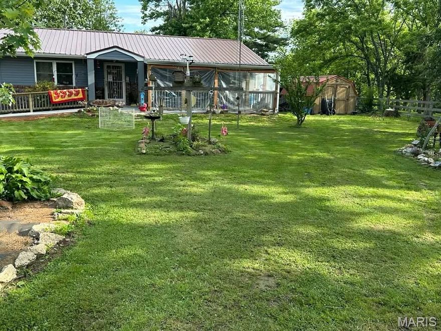 Enjoy peaceful country living on these beautiful 11.83 acres m/l with abundant wildlife right outside your door. This 3 bedroom, 1.5 bath home offers multiple recent updates including new flooring throughout most of the home, new underlayment, and a new sunroom--perfect for relaxing and taking in the views. The property also includes an outbuilding and 5 RV hookups, making it ideal for hosting guests or creating a recreational retreat. Located just a few miles from Maramec Spring Park, this is a rare opportunity for nature lovers, hunters, or those looking for space to roam.