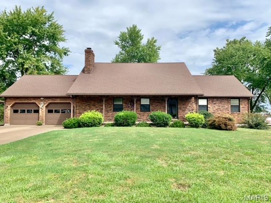 Sellers are ready to downsize so now’s your chance to call this home yours! This property has obviously been very well taken care of. The pride of ownership can be felt all throughout the home. The kitchen is a cook’s dream. Custom oak cabinetry, granite countertops, lazy susans, built in cutting board, lots of counter space, tons of storage and an office area all right at your fingertips! Just off the dining room, through the sliding doors, you will find the best place to set and relax with family and friends. The back covered patio has been coated with epoxy for a beautiful finish and easy clean up. BBQ in style! 
The main level of the home has a very spacious master suite, laundry area, half bath, large living room (complete with a wood burning fireplace), dining room and the kitchen. On the second floor, you will find two bedrooms and a full bath. Don’t miss the large storage area though the first bedroom! The lower level has a family room with another fireplace, a kitchenette, full bathroom, sleeping room, more storage and a workshop area! I really can’t think what more a family could need. 
The yard is well landscaped with flowers of all kinds. Level for easy maintenance. The front porch is very inviting. You have a 24x24 attached garage and plenty of parking for quests! There are two driveways. One on each side of the house so get those party plans made! It’s time to call this one yours! It’s move in ready!!!