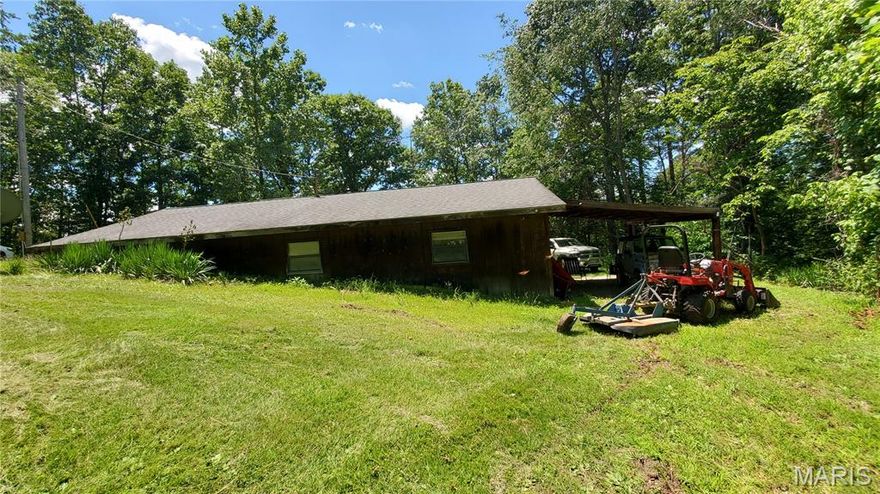 BIG PINEY RIVER FRONTAGE ALONG WITH A HUGE SPRING ON A DEAD END COUNTY ROAD! ONE OF A KIND FIND! 
Has a partial Earth Berm home with two bedroom, two bath drilled well, electric and a PRIVATE PROPERTY FOR YEARS...
has a DETACHED SHOP/GARAGE with a machine shed on the side. VERY UNIQUE PROPERTY.