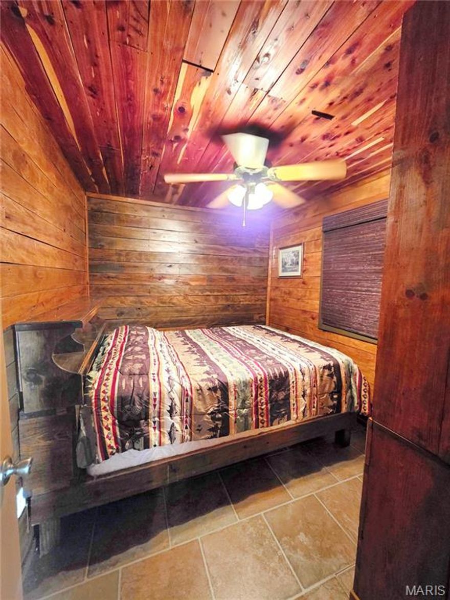 Escape to the lake and enjoy the peace of your own 3.57 acres right off the blacktop! This charming 2 bedroom, 1 bath cabin is move-in ready and full of rustic character, featuring hand-sawed cedar ceilings, an oak accent wall, a cozy porch, and beautiful handmade walnut cabinets. The low-maintenance metal siding makes upkeep simple so you can spend more time relaxing.
The property is already set up with water, electric, a leased propane tank, and lagoon, making it ready for weekend getaways or full-time living. With plenty of room to expand, there’s exciting potential to add camper sites, additional cabins, or create the lake retreat you’ve been dreaming about.
Located just minutes from the boat ramp and the historic town of Florida, where you’ll find a winery, beach, and lake access, this property is perfectly positioned for lake life.
Bring your vision and start enjoying it right away!