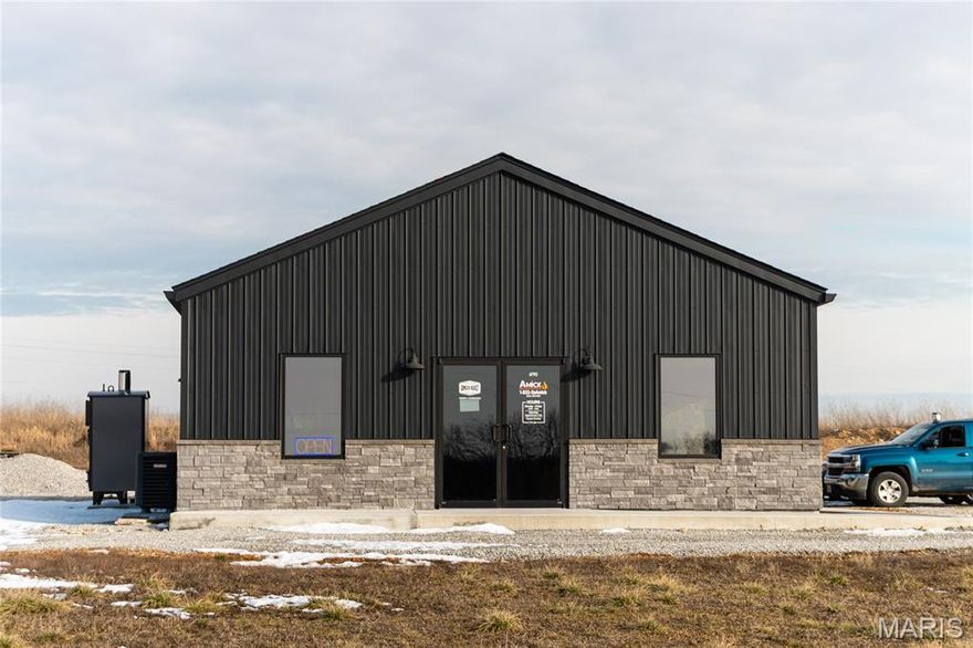 Newly constructed in 2024, this 30 x 48 (1,448 sq ft) commercial building offers an excellent opportunity for your business. The layout features a dedicated reception and office area in the front, with a versatile shop space in the rear that includes a garage door and can be customized to meet your needs. The property includes one restroom and 10-foot ceilings throughout. Ideally positioned with Highway 63 frontage on the west and access from Millstone Road on the east, the site also features an access road along the western boundary and a fire hydrant located at the property entrance. Zoned Highway Business District, this location is well-suited for a variety of commercial uses.