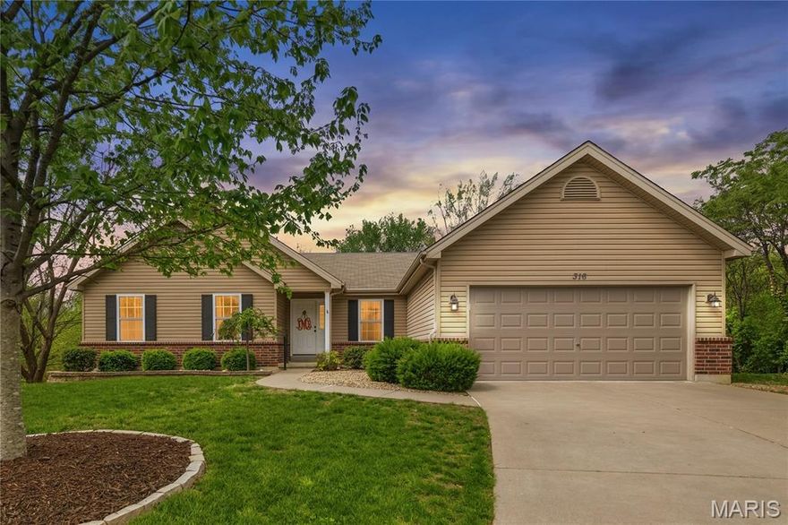 A gorgeous, great room ranch with a finished walkout lower level located on a quiet cul-de-sac in sought-after Lake St. Louis, The owners recently updated and transformed the home to today’s style. Their long hours or labor and work are your gain! New paint and new carpet throughout the main level in 2025. Updated curb appeal with a new stone mailbox, fresh landscaping, brick accents, and a covered front porch. Inside, you are invited by a vaulted great room featuring a gas fireplace with marble surround. The open-concept kitchen features maple cabinetry, a peninsula with raised breakfast bar, pendant lighting, and black appliances, flowing seamlessly into the breakfast room and onto a 12x10 covered deck— overlooking your tree lined backyard, perfect for relaxing. Leading to the immaculate garage with epoxy coating floors is a main level laundry and pantry. A gorgeous primary suite offers a coffered ceiling, dual vanity, and separate tub/shower. Two additional bedrooms and a full bath complete the main level. The finished, walkout lower level adds another 1100 sq ft of living space including a family room, 4th bedroom, and full bath—perfect for your guests or a private home office. Enjoy a prime location close to Founders Park, Quail Ridge Park, I64 and I70 for easy access to interstates.