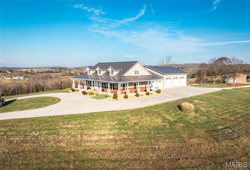 Set in the beautiful Ozark hills in Spring Creek, with sweeping 360-degree views of manicured meadows, hills and cattle grazing, this 66-ac m/l farm with 4 bedrooms, 4.5 baths home just 11 miles from Rolla, offers you all the amenities of refined living and farm.  Meticulously maintained by the owners, this is a working hunting and cattle farm.  Cattle are rotation grazed with moveable high tensile electric wire fencing. The pastures are native grass and fescue with 2 ponds. Wildlife is abundant. A secure electric gate greets you as you travel to the house on a groomer white chat drive to a concrete driveway and surround. The home welcomes you to soaring ceilings, open concept great room with stone fireplace, built-ins and a chef's kitchen. Granite counter tops, island, gas range, 2 large built-in ovens, trash compactor and oversized refrigerator complete the kitchen. A supporting walk-in pantry is within steps of the kitchen. Utility room and half bath finish the hallway to the garage. Primary ensuite is just off the entry with large walk-in shower and double vanities. Upstairs is another bedroom and full bath as well as a craft nook. Lower level has a partially finished rec room, a bedroom, full bath and lots of storage. Following the exit to the garage is a 26 x14, 4th bedroom, full bath and closet that is currently used as an office/man cave. Attached to the 24 x 26 garage is a 40 x 42 heated workshop with four bay doors for equipment storage. There are two chicken coups, and a 32 x 48 pole barn. The house is equipped with GEOTHERMAL/HP heating and air-conditioning, a mini split in the 4th bedroom, as well as a gas furnace in the heated workshop. Hardwood flooring in all main living areas, solid wood interior doors and Anderson windows throughout. Custom cabinets are cherry wood built by Burley Green Cabinets. For all the hunters, this property abounds with trophy bucks, multiple deer herds, quail coveys and large flocks of turkey.  A wrap-around covered front porch is perfect for watching the sun set or rise. For those inspired by this lifestyle, this property represents opportunities for income, privacy, location and refined living.