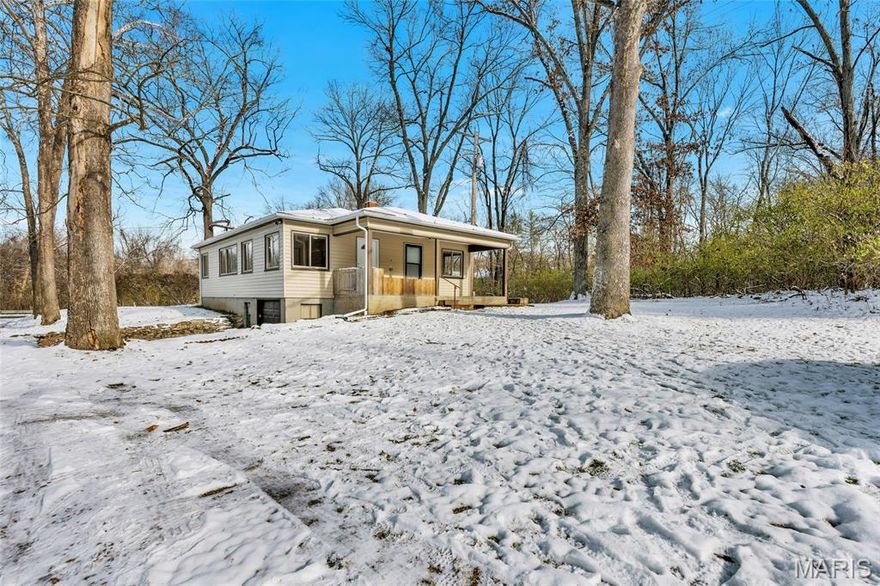 Full of potential, this 2-bedroom, 1-bath ranch offers 1,200 sq ft of natural light from large windows, a spacious living room, eat-in kitchen, and a separate dining room that could convert to a third bedroom. A true blank slate, ready to become your private woodsy retreat! Additional features include a covered front porch, unfinished walkout basement, and tuck-under garage.
Recent updates include a new roof and gutters (2024) and a new septic system (9/2025) designed to accommodate a 3-bedroom layout, offering flexibility for future expansion.
Car enthusiasts and hobbyists will love the 728 sq ft detached garage (1996) with a separate electrical panel and 220 power, providing a huge workshop space.
Situated on a secluded wooded lot backing to common ground, yet minutes from shopping, dining, and major highways in the award-winning Parkway School District!