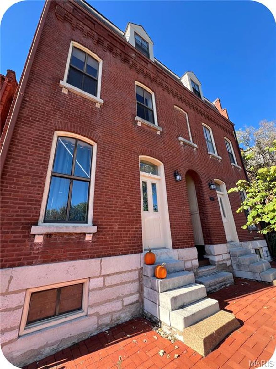 If the words “carriage house” make your heart skip a beat, clear your schedule—this Soulard gem is calling your name. Tucked in the heart of one of St. Louis' most fun, walkable neighborhoods, this 5-unit property is a rare find. You're just steps from local favorites like McGurk’s, Tucker’s Place & Molly’s, so whether it’s brunch, patio hangs, or late-night eats, you’re right where the action is. At the front of the property is a large four family & at the back is a sweet carriage house; both underwent a complete renovation in 1984.

Let's talk about the four family first: The first-floor apartments both have 1 private bedroom/1-bath. The second floor apartments are set up townhome-style & each have 2 bdrms/1.5 baths. On the main level you'll find a big living room with wood-burning stove, kitchen, half bath & laundry. Head up to the third floor & you'll see 2 bedrooms, full bath & a deck.

But the real heartthrob? The carriage house out back. This two-story, 2-bed/1-bath cutie has its own laundry, private basement & off-street parking, making it a dreamy rental—or your own private sanctuary. Whether you're looking to live in one unit & rent the others, start your real estate investment journey, or just want a place with serious Soulard soul—this is it. Want the inside scoop? Don't get lost in the Zillow shuffle—contact me directly for a private tour!