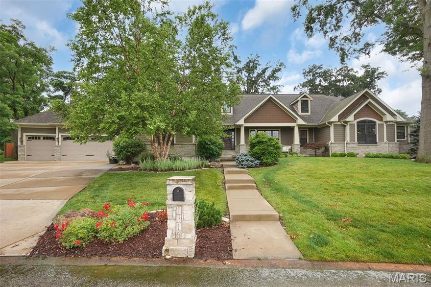 Outstanding Custom Ranch Home in highly desirable Harwood Hills. This open, flowing layout features 3,600 sq ft on the main level plus 2,000 sq ft finished below. Highlights include hardwood floors, custom doors, stone fireplace, elegant bathrooms, arched entries, and a luxurious primary suite with a huge walk-in closet. Two additional main-level bedrooms and a private 4th bedroom suite offer flexibility. The gourmet kitchen features high-end stainless appliances and a large center island perfect for any chef. Main-level laundry adds everyday convenience. The finished lower level—with 9' pour and no columns—includes a theater, bar, game room, two bedrooms, and full bath. A stunning open oak staircase connects both levels. Outside, enjoy a fenced yard, low deck, 20x20 pergola with 60" gas grill, fireplace, smoker, sink, and a charming manmade creek with waterfalls and bridge.  The three car attached garage adds to the luxury.   Energy-efficient 14 SEER+ HVAC system included. Luxury and comfort inside and out.