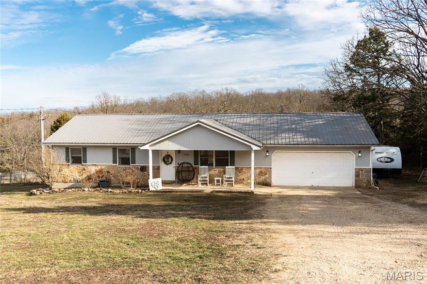This beautifully maintained 3-bedroom, 2-bath home sits on 2.25 private acres, offering the perfect blend of comfort, space, and peaceful surroundings — all while being just 5 minutes from the south gate of Fort Leonard Wood. From the moment you arrive, you’ll appreciate the inviting covered front porch — the perfect spot to relax and take in the quiet setting. Inside, the home features luxury vinyl plank flooring throughout, creating a seamless and low-maintenance living space. The layout is both functional and welcoming, ideal for everyday living and entertaining. Step outside to enjoy your own backyard retreat complete with a pool and a spacious deck, newly installed in the summer of 2023 — perfect for summer gatherings. The septic system was installed in summer 2022 and was recently pumped and inspected this past summer, offering added peace of mind. The property provides exceptional privacy and includes trails at the back, making it ideal for outdoor enthusiasts. Three storage sheds offer plenty of room for tools, equipment, or hobbies. The garage includes a workbench and storage shelving that will remain with the home, and there is even a 30-amp camper hookup for added convenience. Washer and dryer are negotiable. If you’re looking for a well-cared-for home with acreage, privacy, recent updates, and close proximity to Fort Leonard Wood, this property is a must-see.