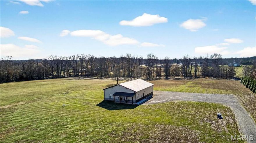 Equestrian enthusiasts dream! This is a one-of-a-kind 5.96+/- acre completely LEVEL lot in MARTHASVILLE, complete with a custom-built post-frame building. The front 800 SF is a gorgeous, completely furnished barndominium, with an attached barn/garage/workshop that can be uniquely finished to your liking with a 20’ vaulted ceiling! Charming covered front porch featuring old-world, hand-hewn timbers, overlooking the beautiful/peaceful sprawling front yard. 9’ Ceilings, concrete flooring & solid wood doors throughout. Step inside the kitchen/living room combo featuring a wood beam ceiling, recessed lighting, custom cabinetry & butcher block countertops. The bedroom boasts a sliding door entry, recessed lighting, a wood-plank accent wall w/built-in shelving & 2 closets. Hall full bath flaunts a single-sink vanity & a custom-tiled shower w/sliding glass doors. Laundry room w/stackable washer/dry & walk-out to attached barn/garage/workshop. Great property with plenty of land left to expand or build your dream home on, also. SCHEDULE YOUR SHOWING TODAY!
