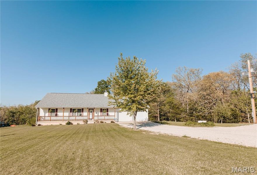 Open split floor plan 3 bath ranch on 3 acres with a partially finished walk-out lower level. This home clearly reflects the care and attention it has received. As you pull into the freshly graveled driveway, you’re welcomed by a manicured yard, covered front porch, and attached two-car garage. Inside, wood flooring flows through the open living, and dining areas, creating an inviting space perfect for everyday living and entertaining. The living room features a gas fireplace with insets and a mantel centerpiece. The thoughtfully designed layout includes a secondary main-level bedroom with convenient access to a full guest bath. The primary suite is privately situated on the opposite side of the home and offers a spacious walk-in closet and full bath. The laundry and pantry areas are strategically placed for privacy and minimal noise. The kitchen features an eat-in bar and opens to an updated and extended back deck that covers the patio below. The walk-out basement offers a great mix of finished and unfinished space, including a family room area, workbench, storage, a finished non-conforming room with closet, a full bath, and more. Outside, a shed sits near the tree line, leaving plenty of open yard space ideal for kids, animals, or outdoor enjoyment.