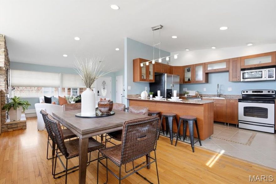 Showings begin Wednesday! Located in the University City, this beautifully updated mid-century home seamlessly blends classic architectural character with modern, high end finishes. The open concept layout and thoughtful design choices create a space that is both stylish and highly functional for everyday living. Living & Dining Spaces - The main living area features a stunning stone-veneer accent wall with a functional fireplace, serving as the room's focal point. Large clerestory windows and vaulted ceilings flood the space with natural light, highlighting the rich hardwood flooring that runs throughout. The transition into the dining area is effortless, offering views of the expansive backyard through large, sun-drenched windows. Modern chef’s kitchen is a standout feature, designed with both aesthetics and utility in mind with warm wood-toned cabinets with sleek silver hardware, including glass front upper displays, elegant granite surfaces that provide ample prep space and a large breakfast bar for casual seating. Fully equipped with stainless steel appliances, including a French-door refrigerator and a modern range. A partially finished lower level
is an incredible vibrant second living area. Deep navy blue walls contrast beautifully with plush light carpeting and white trim. This versatile space is ideal for a media room, home office, or play area, featuring a drop ceiling with integrated lighting and plenty of room for oversized furniture. This home also offers a private and expansive outdoor retreat with a large concrete patio off the rear entrance is perfect for grilling and outdoor entertaining.
The level lot is fully enclosed by a privacy fence, offering a secure space for pets or gardening and a detached storage shed provides plenty of room for lawn equipment and seasonal items. Located on a warm welcoming street close to the new Target, Costco and Dierbergs development, you dont want to miss this amazing home!