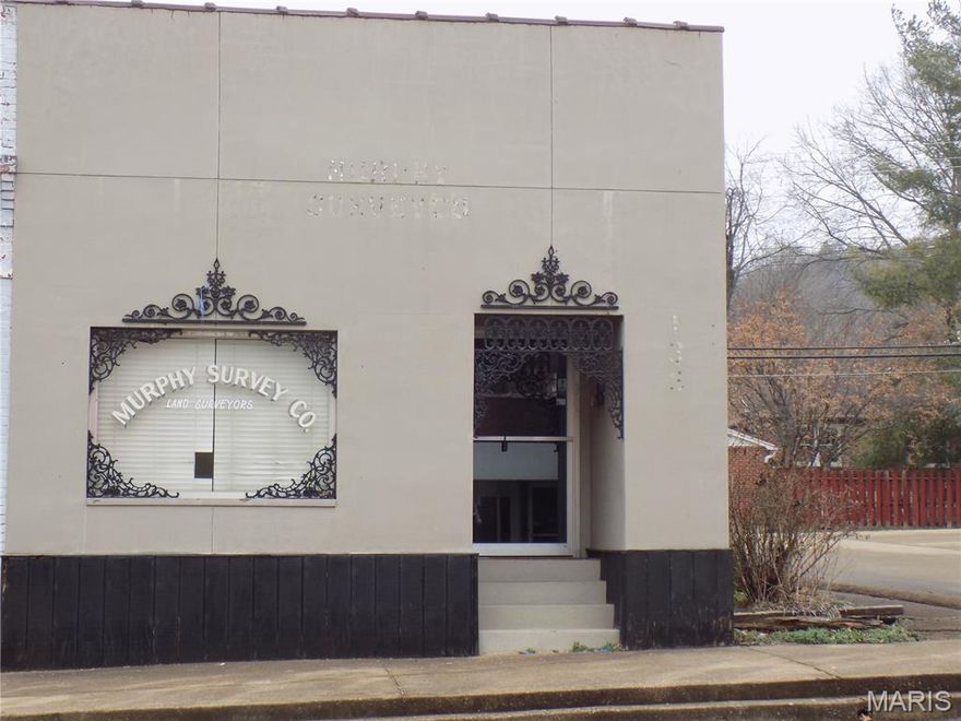 NIce, commercial building located in downtown Ironton, with a large city lot next to it, used for parking. Stucco, exterior, with 2 office rooms and 2  (half baths) formerly used for surveyors office, and beauty shop, has central air, and heat, and a partial basement,  Could be yours for $60,000