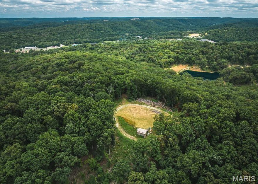 This 10-acre tract in House Springs, MO offers the perfect mix of seclusion and convenience. Nestled at the end of a private trail, the property boasts breathtaking views of the bottomland below and is just minutes from Highway 30—making for a quick and easy commute to St. Louis. A true outdoorsman’s paradise, the land is loaded with whitetail deer and wild turkeys, and is surrounded by larger tracts and landowners, keeping traffic minimal and wildlife plentiful. Whether you're looking to build your dream home, create a private hunting retreat, or simply enjoy a peaceful weekend getaway, this property checks all the boxes. It features mature, marketable timber, a small scenic clearing ideal for a cabin or campsite, and even includes a shipping container with an elevated observation deck—perfect for soaking in those classic Missouri sunsets or scouting your next hunt. Proof of funds or bank letter to be provided to agent to come take a look today! Multiple 10 acre tracts available or buy the entire 40 acres.
