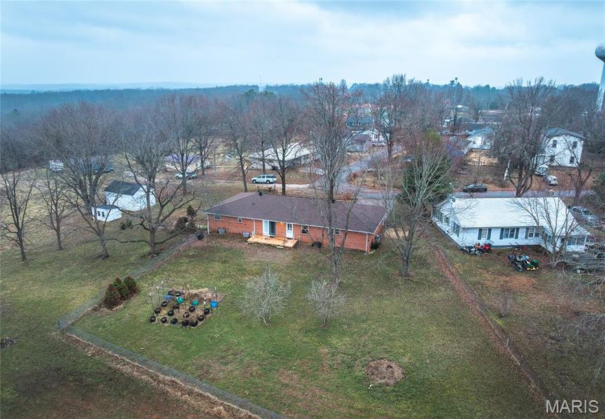 Spacious all-brick ranch located in the heart of St. James on approximately 2 acres. This well-maintained home offers 3 bedrooms and 2.5 baths, all on the main level, with a functional layout and generous room sizes throughout. The main floor includes a large family room with a gas fireplace, an additional living room that opens to the dining area, and a roomy main-level laundry.

The finished walkout lower level provides added flexibility with a second kitchen, living area, and additional finished space suitable for a home office, hobby area, or guest use. 

Additional features include insulated tilt-in windows, attached garage with extra parking, workshop and storage buildings, and level, usable acreage within city limits. Public water and sewer. The home is vacant, clean, and move-in ready, allowing for flexible and quick possession.

Conveniently located near schools, local amenities, and I-44 access.
