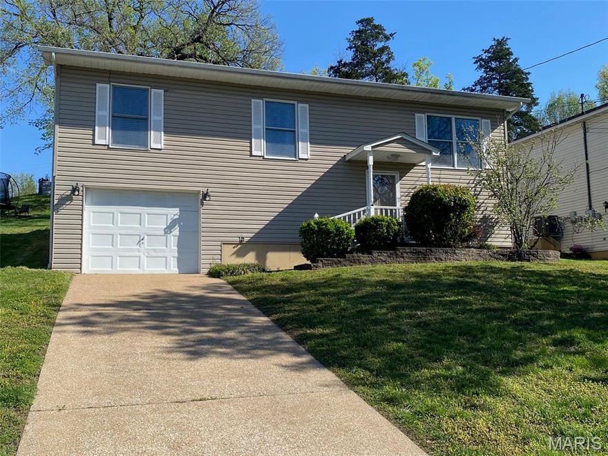 This charming,  furnished, 3-bedroom, 2-bath home in Hermann, MO offers a comfortable and inviting layout with a bright, open main living area perfect for everyday living and entertaining. The living room flows seamlessly into the dining area, where you’ll find a nice walkout to the back patio, ideal for relaxing or hosting gatherings. Finished lower level is perfect for extra family room, office or use as a sleeping area. An attached garage adds convenience, while the home’s functional design makes the most of every space. Current seller rents this home as a Guesthouse, and is selling Turn-Key, business can be transferrable to new licensed owner! Located in the heart of Hermann, you’ll enjoy small-town charm with nearby amenities, wineries, and scenic surroundings.