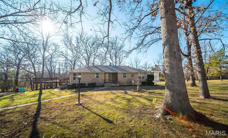 Discover peaceful country living just minutes from town in this beautifully updated ranch-style home on approx. 1.6 acres. Recent upgrades include a new electrical panel, well pump, newer A/C, fresh paint throughout, and stylish laminate flooring—plus elegant porcelain tile in the living room and kitchen. This warm and welcoming brick home offers 3 bedrooms and 1 full bath on the main level, with an additional bedroom and bathroom in the fully finished basement—perfect for guests, extended family, or extra living space. Step outside onto the expansive deck, ideal for morning coffee, evening sunsets, or weekend gatherings. From here, take in the view of the classic red horse barn and fenced area—ready for your horses or future farm animals. Nestled on a corner lot, the property offers a wonderful balance of privacy and convenience, giving you that country feel while keeping you close to everything you need. To top it off, the sellers are including a Home Warranty credit for added peace of mind. Move-in ready, thoughtfully updated, and full of charm—this is country living at its best.