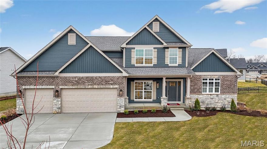 MOVE-IN READY ON HOMESITE 306! Welcome to your dream home at 113 Royal Troon Drive in the prestigious Inverness community of Dardenne Prairie, MO. This remarkable 1.5-story Muirfield residence offers over 3,600 square feet of beautifully crafted living space, blending timeless design with modern convenience. Featuring 4 bedrooms and 3.5 bathrooms, this home delivers the perfect balance of elegance and functionality. The gourmet kitchen is designed to impress, with GE built-in appliances, quartz countertops, and an expansive layout ideal for both daily living and entertaining. A butler’s pantry adds sophistication and convenience, connecting seamlessly to the formal dining space. The great room is anchored by a striking 55-inch electric fireplace and framed by large windows that fill the space with natural light. Step outside to the 16x14 covered porch, complete with lighting and a ceiling fan — the perfect setting for relaxing evenings or weekend gatherings. The owner’s suite is a private retreat with its spa-like bath and a generous walk-in closet designed to fit every lifestyle. Additional highlights include open stairs to the lower level and energy-efficient Pella windows throughout. Perfectly situated in the heart of Dardenne Prairie, this move-in ready Muirfield combines McKelvey Homes’ renowned craftsmanship with luxurious details throughout. Schedule your private tour today and experience first-hand why Lot 306 at Inverness is the perfect place to call home.