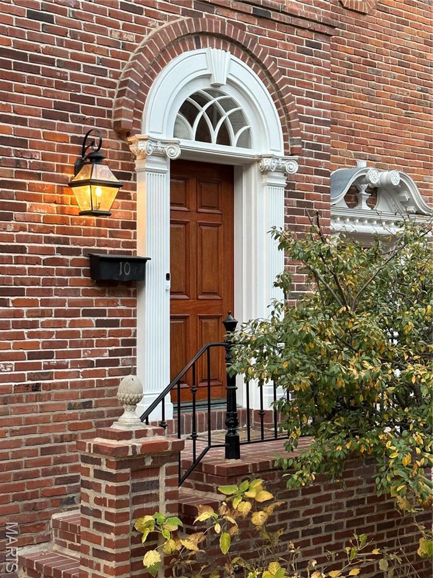 Introducing a spacious and lovely Georgian townhome situated in the Clayton Gardens neighborhood. This distinctive property features a 3-story elevator, 10ft ceilings on the first floor, and timeless crown molding throughout. The generous living space includes a gas fireplace, an open dining and living area, and a large kitchen / informal family area. The primary suite offers a large dressing room, a newly renovated dual vanity bath with a soaking tub and separate shower, and an adjacent laundry room. The second floor is completed by two additional large bedrooms and a newly renovated hallway bath. The finished lower level expands the total living space to 4027 sq/ft and can be utilized for various purposes as per the buyer’s preference. A substantial storage/second laundry room and an attached two-car garage further enhance this unique townhome. Discover why this property epitomizes the perfect blend of functionality and elegance in the heart of Clayton. Location: Interior Unit