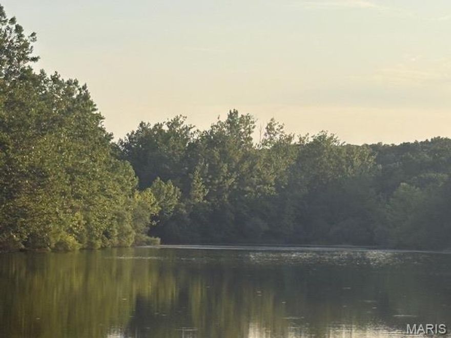 Lake Front Lot on Small Private Lake / Summer Lake! This a private oasis on this 12 acre lake. Imagine walking out your back door and casting out your line ... 

Live like you're on vacation every day with resort-style amenities, also including:

4 private community lakes for fishing, boating, kayaking

Beaches, swimming, and scenic lake views

Golf course, country club, and on-site restaurant

Hiking, biking trails, campgrounds, and sand volleyball

A golf cart-friendly community for relaxed neighborhood living

You can bring your own builder and plans, or hold the land as an affordable way to enjoy Raintree's full range of recreation and lifestyle benefits.

Ownership includes access to the Country Club for just $271/year, and full community amenities for only $250/year. All of this just 35 minutes from South County (63128)!

Build your own lifestyle and just getaway from it all.  See all photos for a glimpse into the incredible Raintree lifestyle. As a resident myself, I can confidently say: it’s an amazing place to live, play, and relax. Come join us!