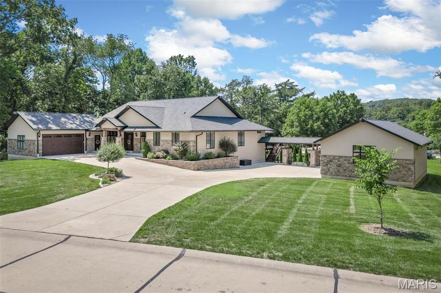WOWZERS! Custom built, 5 year old sprawling ranch home with over 4800sqft, a 4 car garage in Lindbergh Schools! Sitting on a level 0.71 acres, fully fenced yard, ample parking and more! The main floor features and entry foyer,  hand scraped hardwood floors, 9' ceilings, custom millwork, home office, formal dining room with tray ceiling, great room with wall of windows/doors with power shades, stone gas fireplace, custom kitchen with huge center island, stainless Bosch appliances, breakfast bar and room, french door to maintenance free partially covered oversized deck. The master is grand with a tray ceiling, separate his/hers walk in closets, en-suite bath fit for royalty with separate vanities, stand alone tub, roll in shower and skylight. There are 2 additional bedrooms each with their own private en-suite bath and WI closet, and main floor laundry room on main level. The stairs are open to the finished walk out lower level with huge family room, rec room, half bath, full custom wet bar, stone gas fireplace, 4th bedroom with private bath and closet. There is an attached 2 car and an oversized semi-detached 2 car garage with hvac, 10' ceilings, workshop and more. The driveway is enormous, yard is level and fenced, landscaped and ready for family gatherings or a pool. There are 3 zones to the hvac, new gutters, vaulted ceilings, outdoor kitchen area, central vacuum, Anderson windows and custom everything!! This one is a 'must see inside' home! Showings start Tuesday 7/8/25.